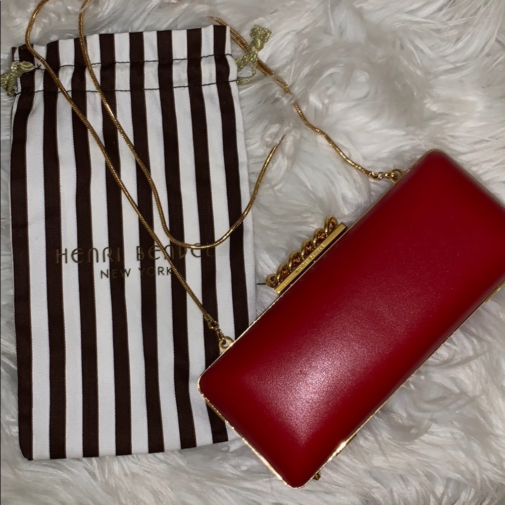 Henri Bendel red and gold clutch.